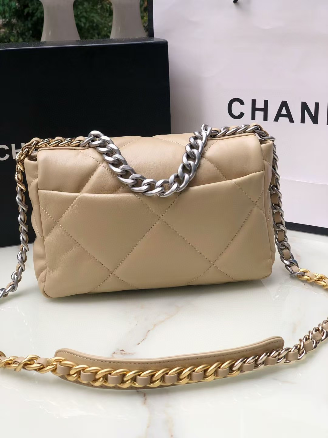 Ch*el 19 handbag shiny leather, gold-tone, silver-tone & ruthenium-finish metal beige 26x16x9cm