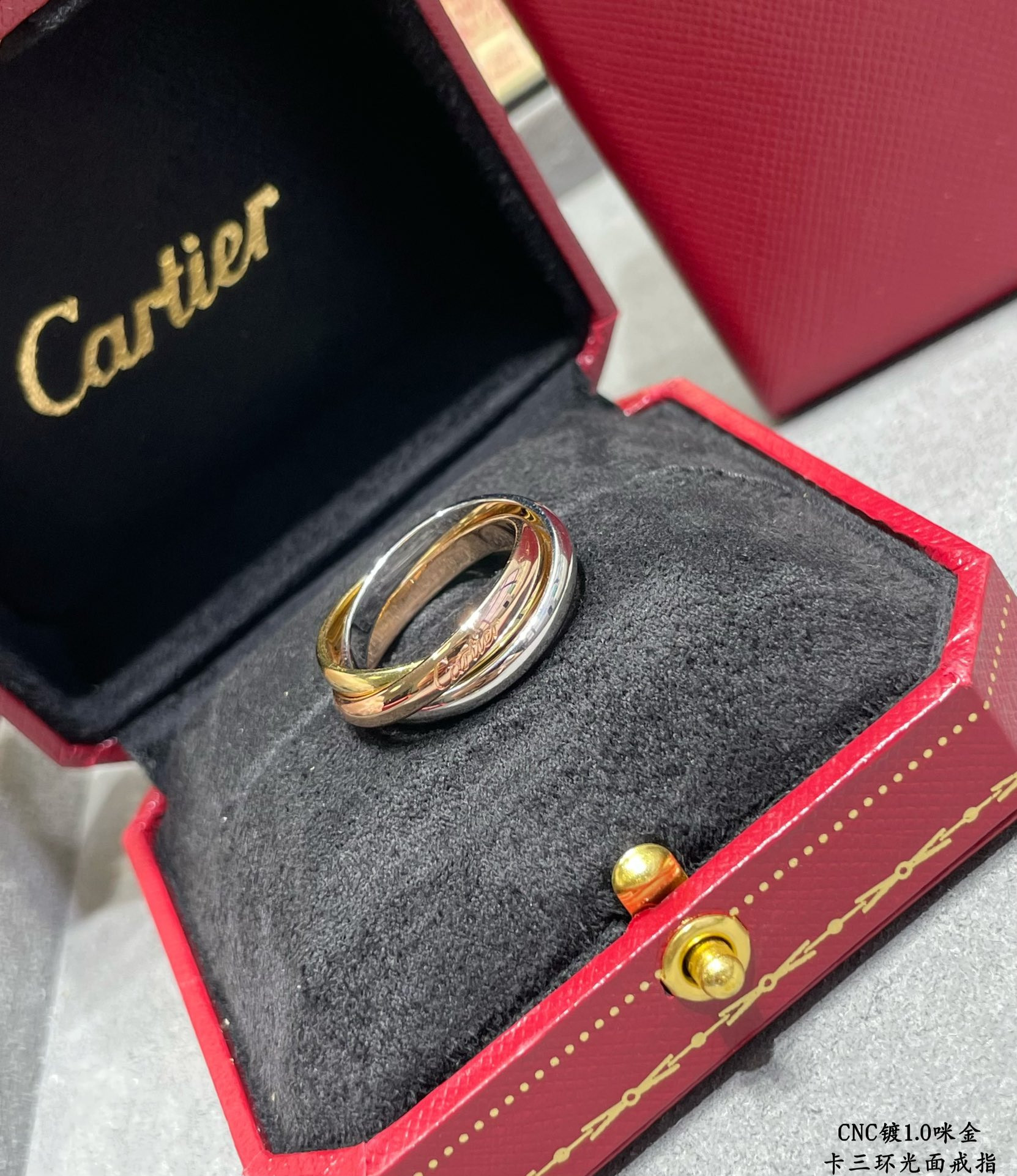 Ca*t*er three-ring polished ring
