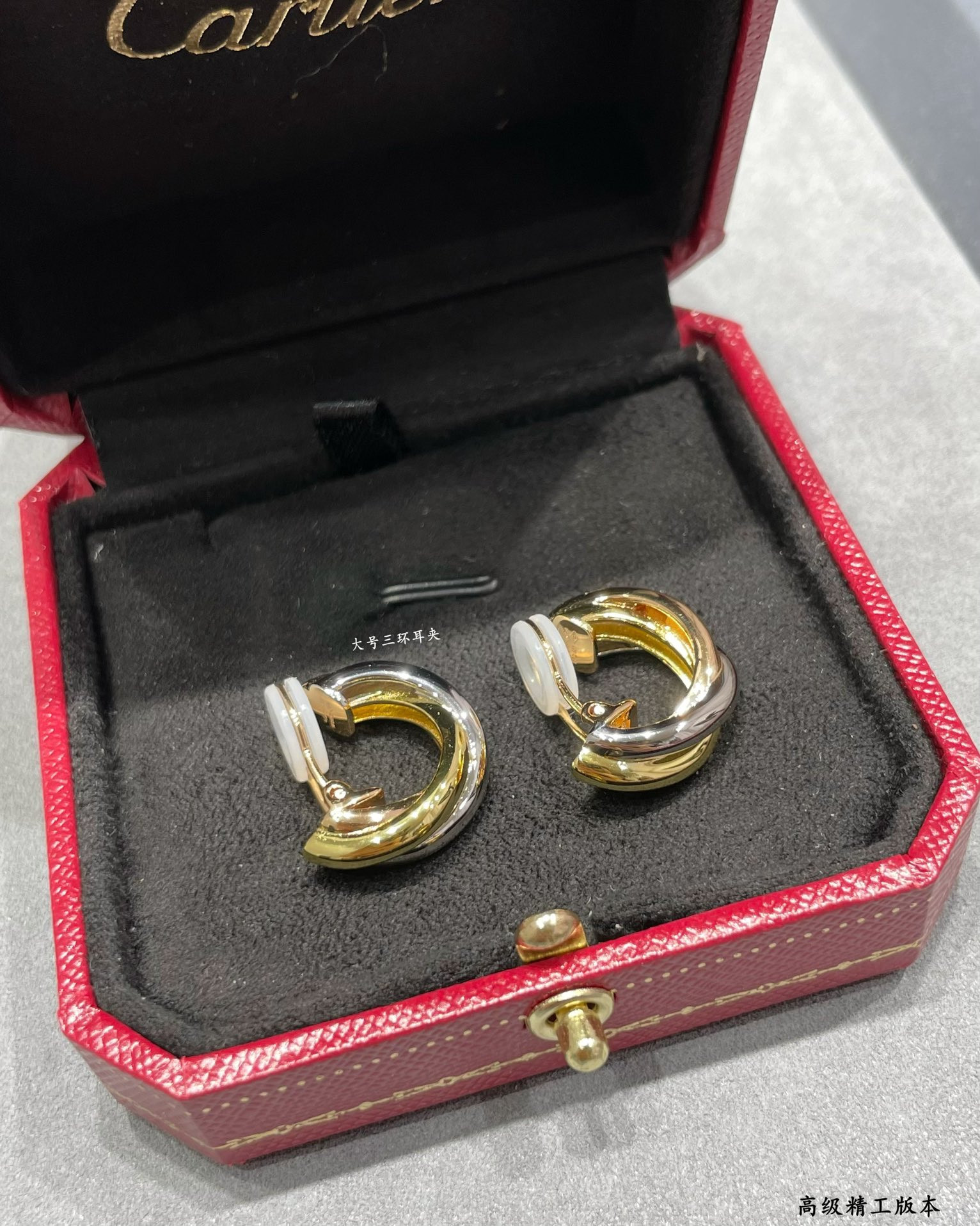 Ca*t*er large three-hand earrings