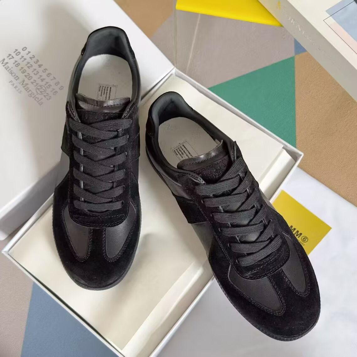 ua ma*s*n Ma*i*la mm6 sneakers