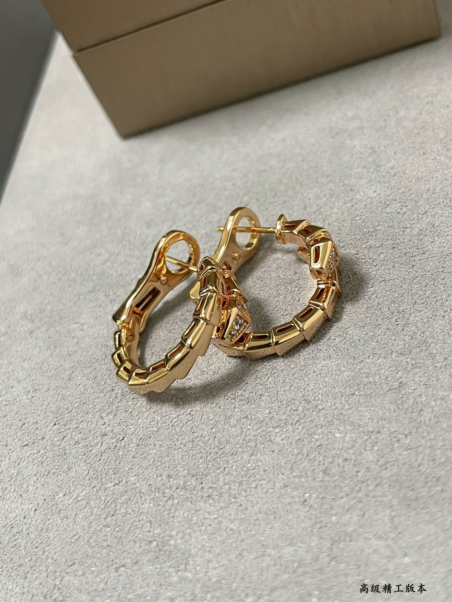 B*l*ai head and tail drill snake earrings