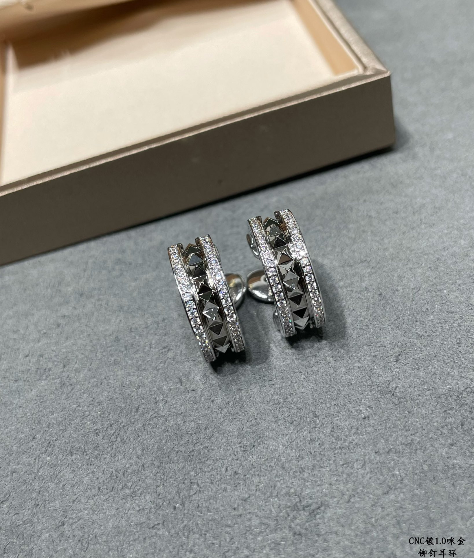 B*l*ai drill rivets on both sides earrings