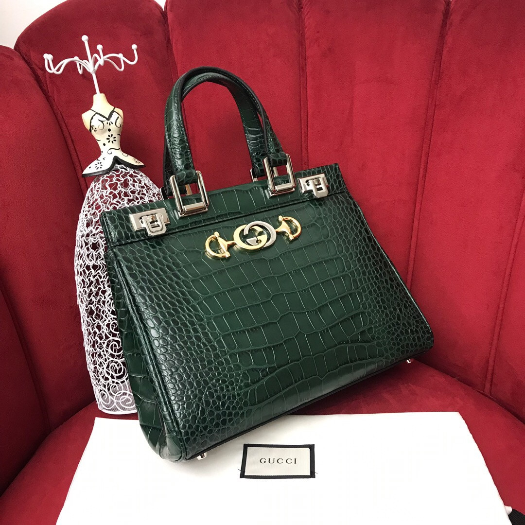 G*u*i zumi leather medium top handle bag