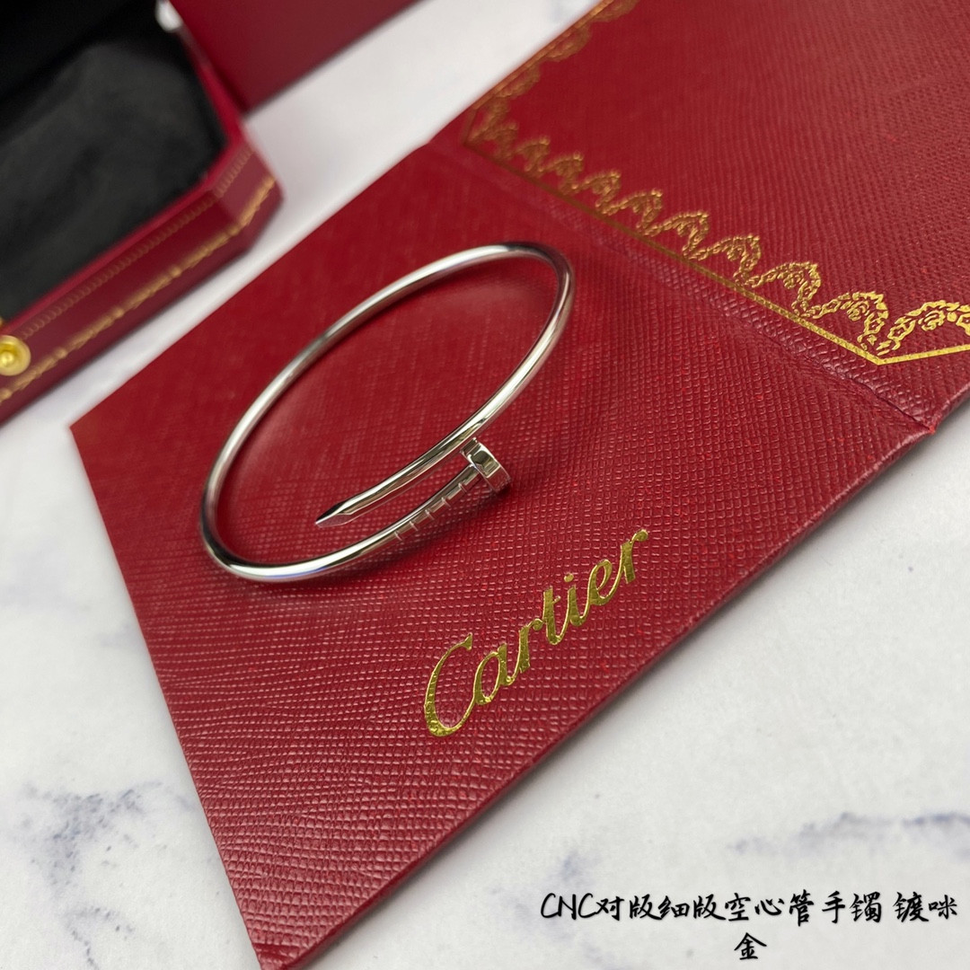 Ca*t*er thin hollow tube polished nail bracelet