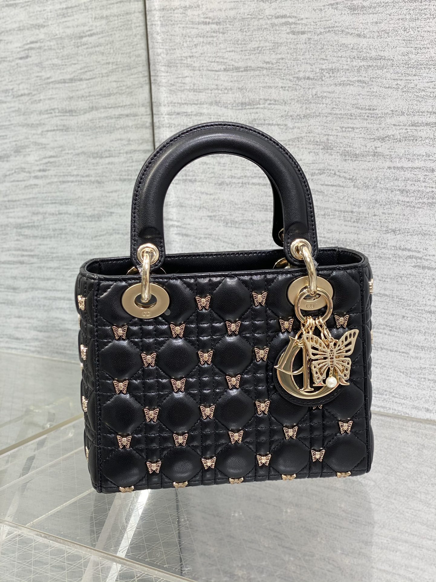 small lady D*or black with butterfly studs