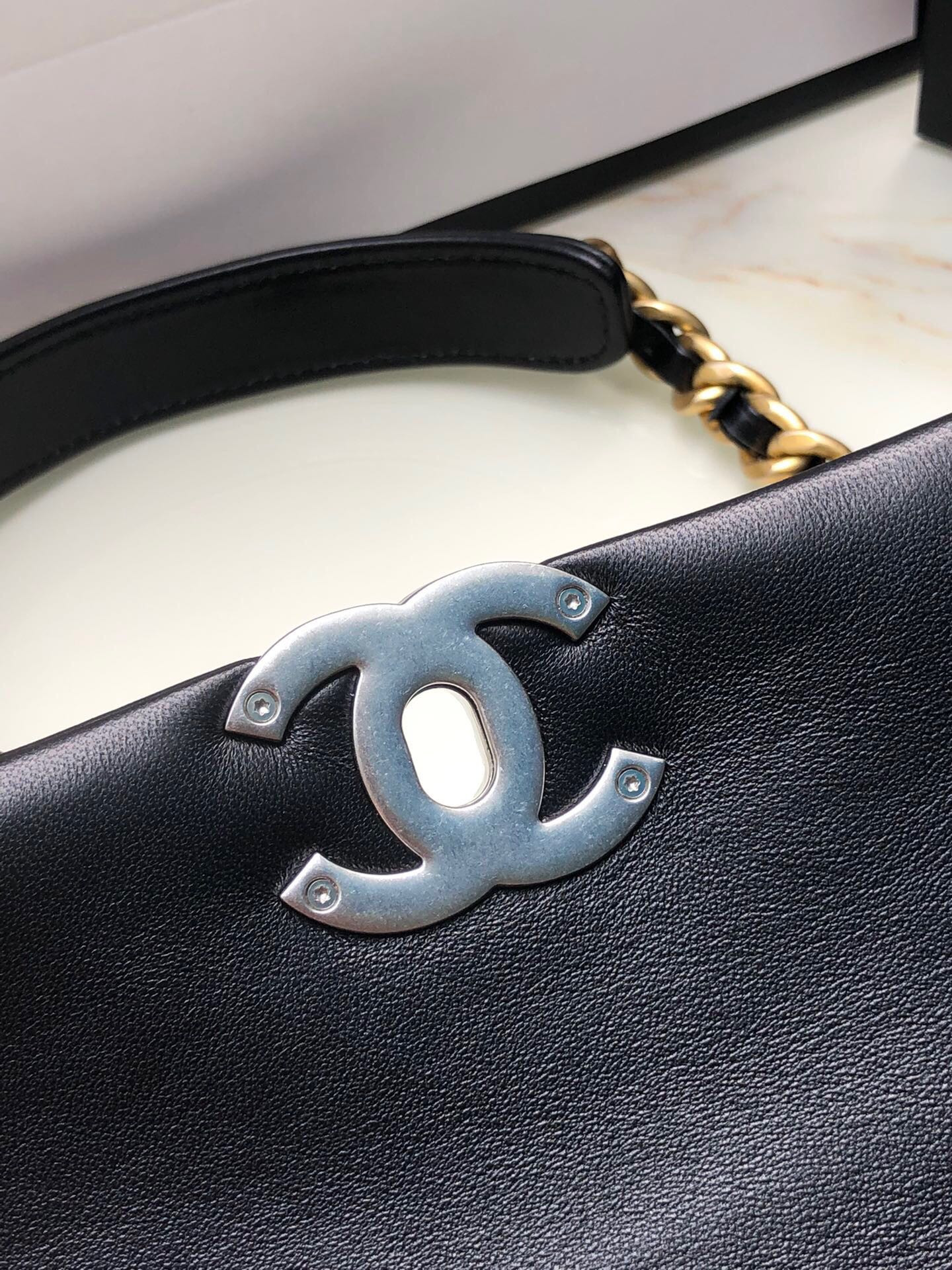 Ch*el 19 handbag shiny leather, gold-tone, silver-tone & ruthenium-finish metal black 6.2 × 10.1 × 3.5 in