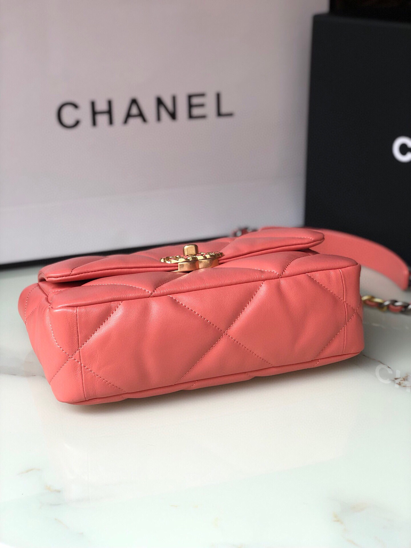 Ch*el 19 handbag shiny pink gold-tone, silver-tone & ruthenium-finish metal 6.2 × 10.1 × 3.5 in