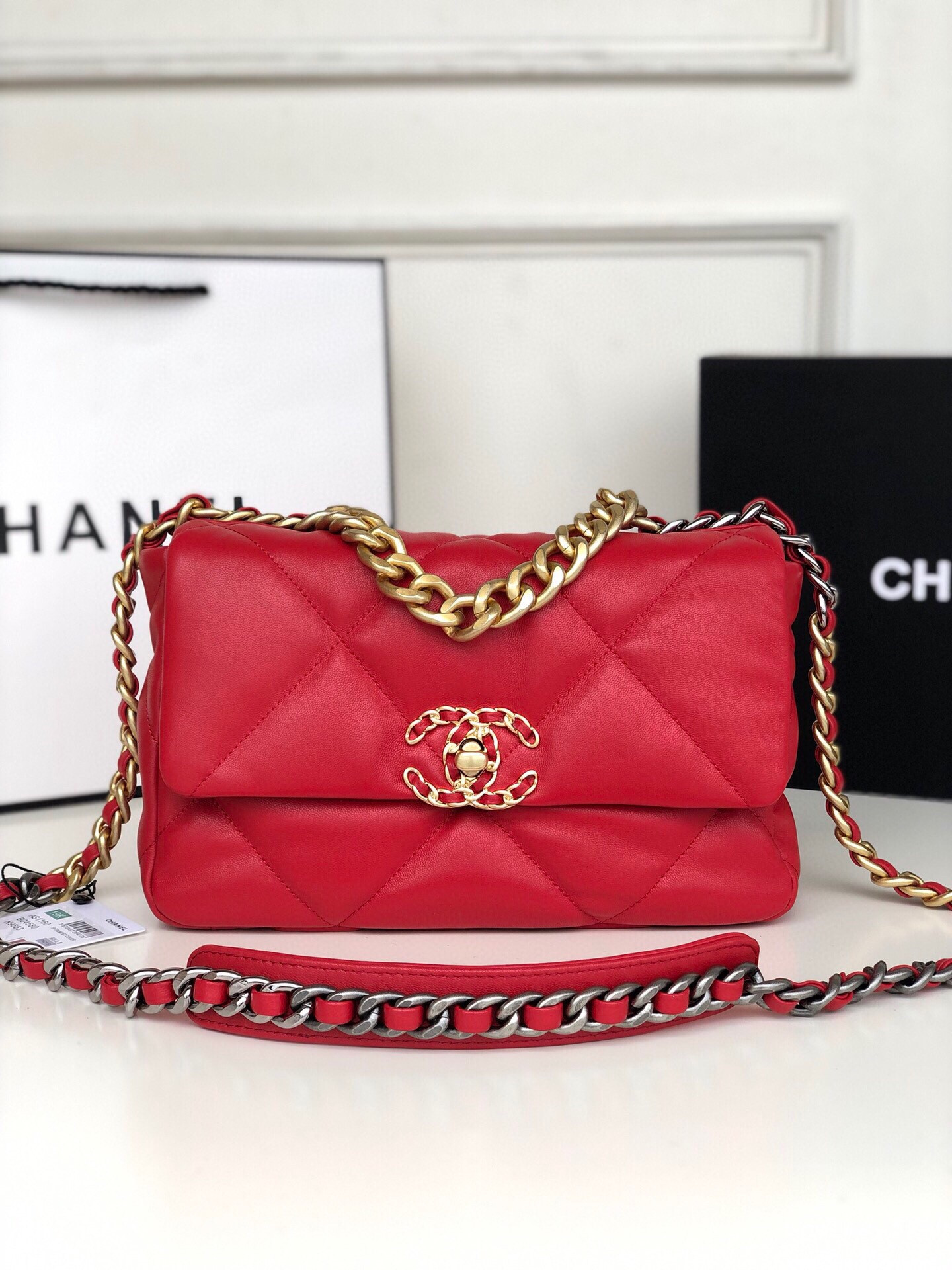 Ch*el 19 handbag shiny leather, gold-tone, silver-tone & ruthenium-finish metal red 6.2 × 10.1 × 3.5 in