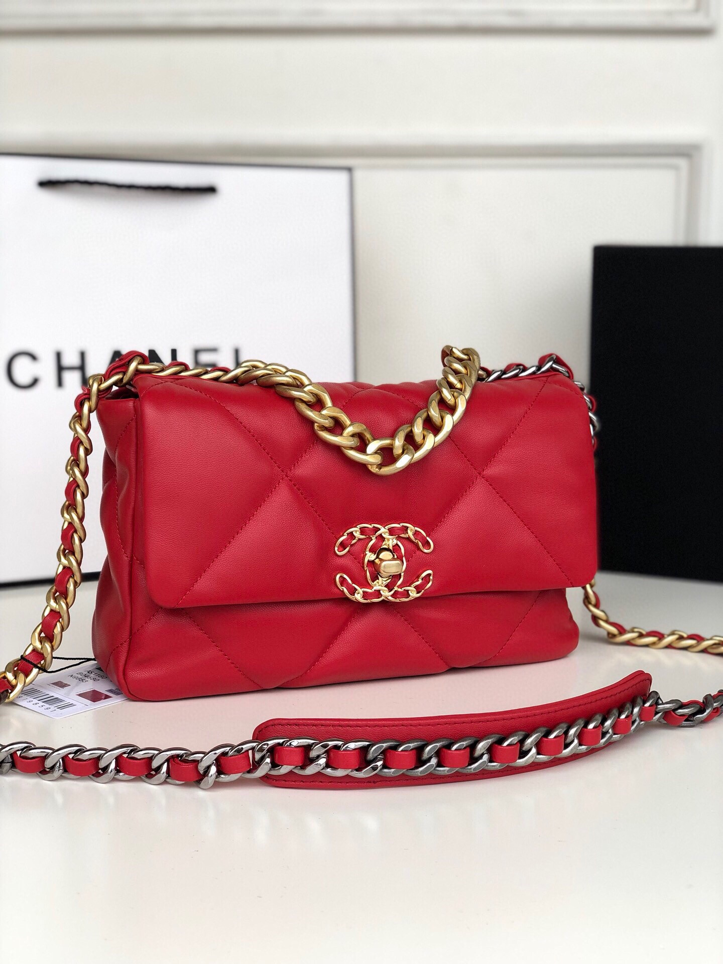 Ch*el 19 handbag shiny leather, gold-tone, silver-tone & ruthenium-finish metal red 6.2 × 10.1 × 3.5 in