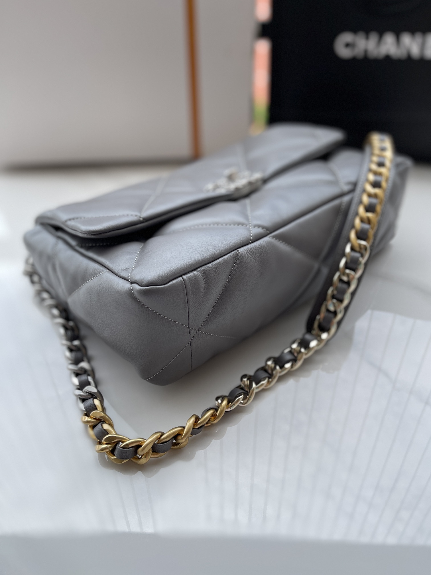 Ch*el 19 large handbag shiny leather, gold-tone, silver-tone & ruthenium-finish metal gray 7.8 × 11.7 × 3.9 in