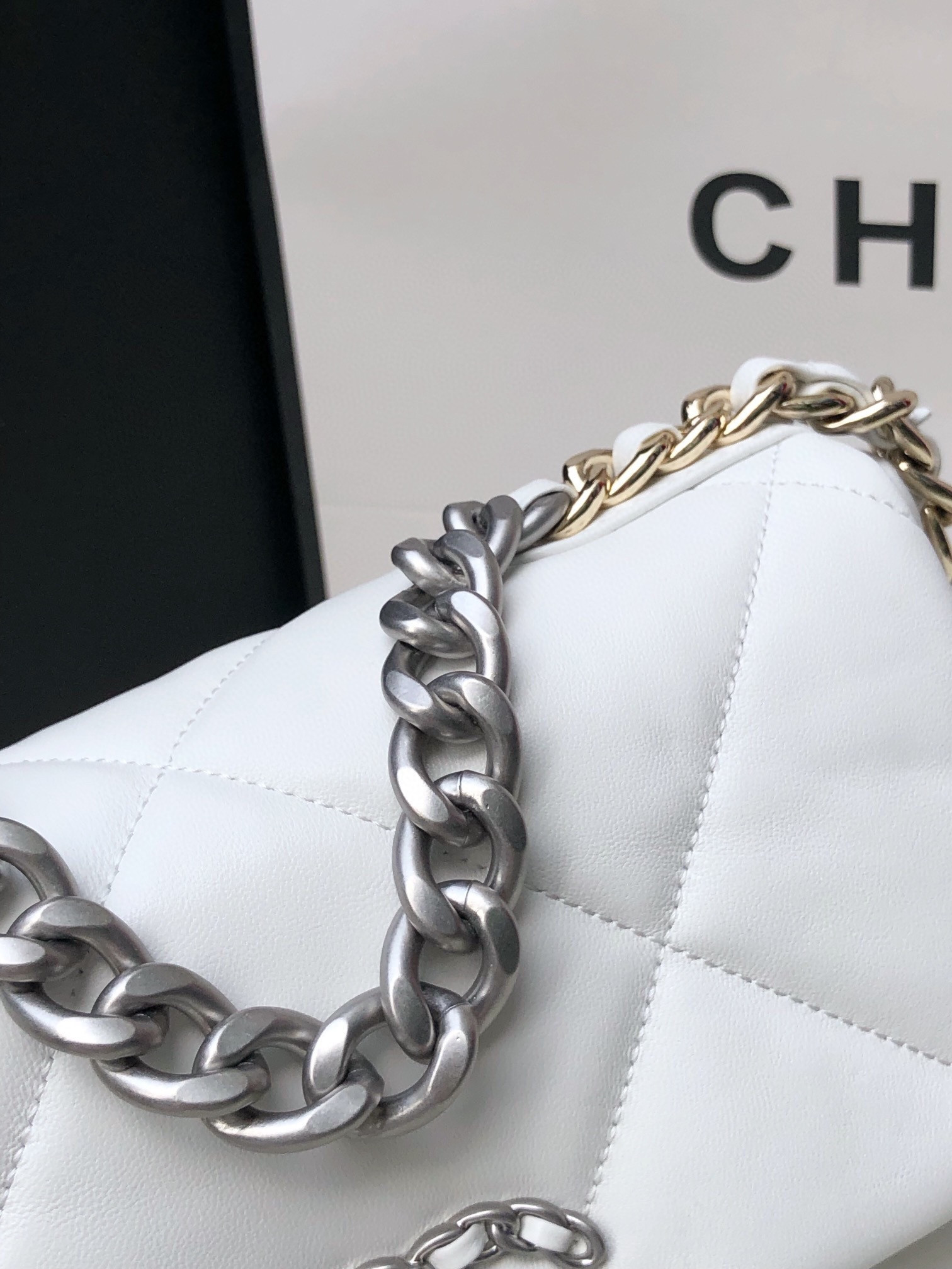 Ch*el 19 handbag shiny leather, gold-tone, silver-tone & ruthenium-finish metal white 6.2 × 10.1 × 3.5 in
