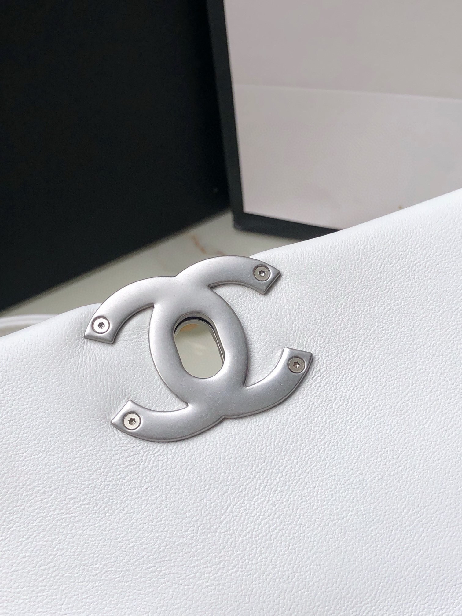 Ch*el 19 handbag shiny leather, gold-tone, silver-tone & ruthenium-finish metal white 6.2 × 10.1 × 3.5 in