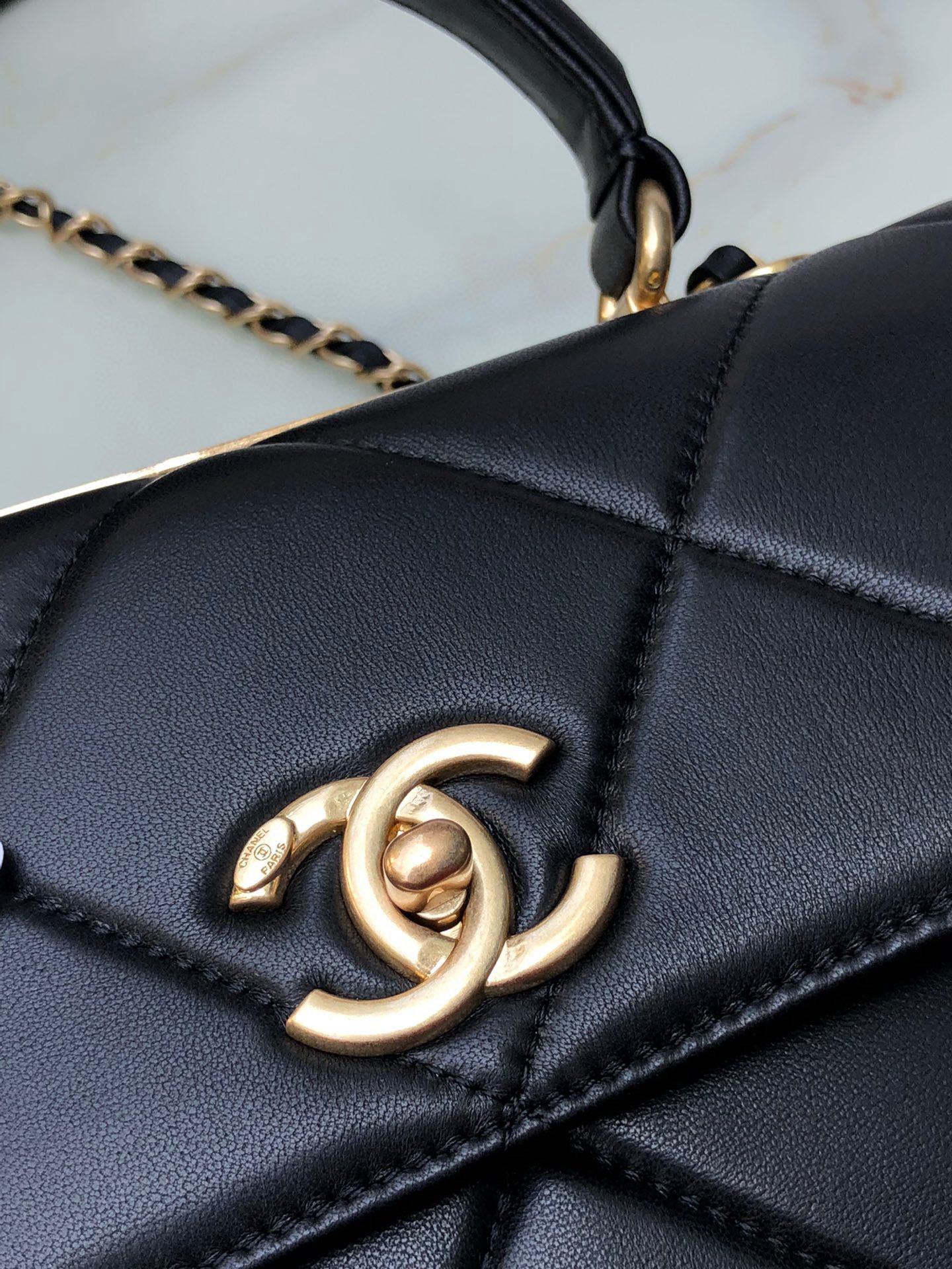 Ch*el flap bag with top handle 6.6 × 9.8 × 4.7 in