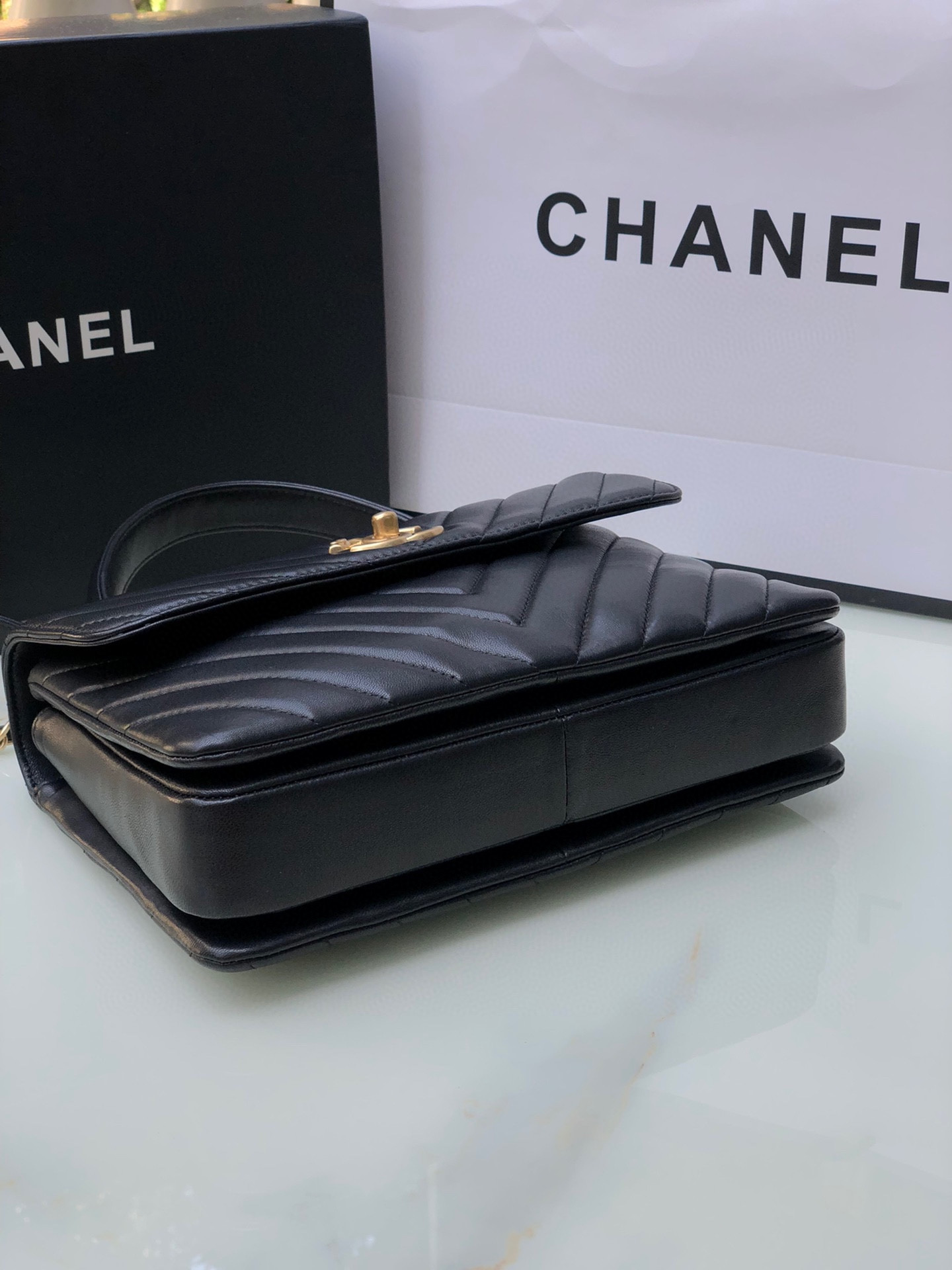 Ch*el flap bag with top handle 6.6 × 9.8 × 4.7 in