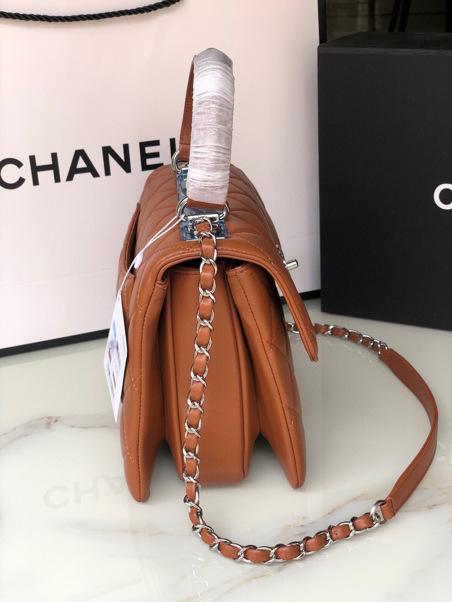 Ch*el flap bag with top handle 6.6 × 9.8 × 4.7 in