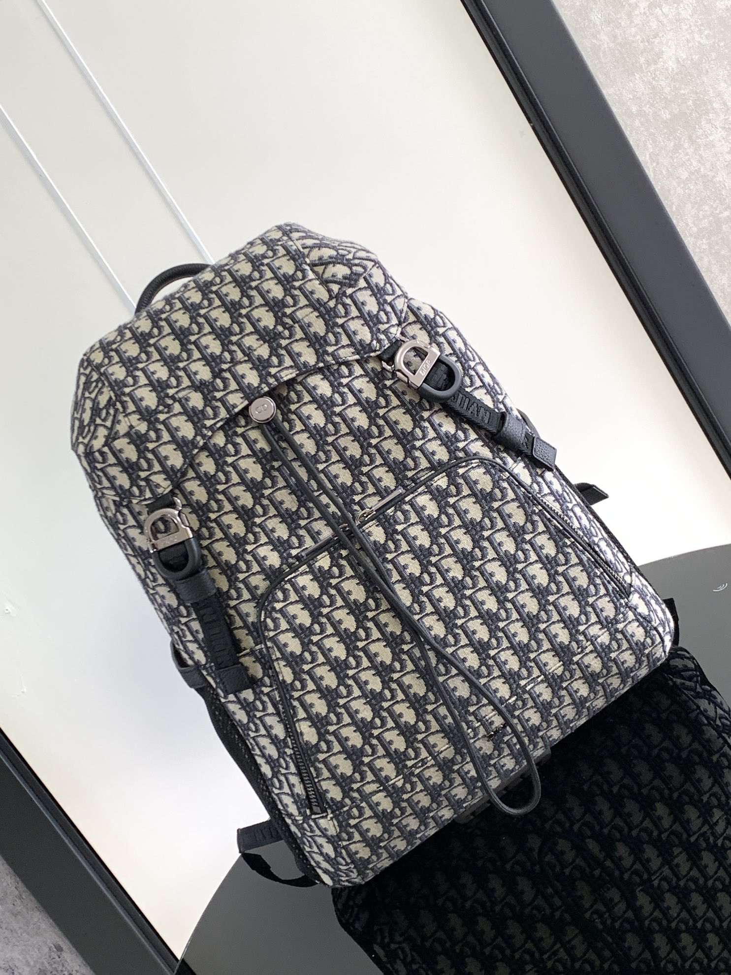 D*or 8 backpack with flap beige and black D*or oblique jacquard 31 x 48 x 16.5 cm