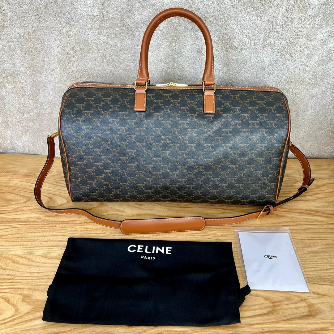 Ce**e large travel bag in triomphe canvas with Ce**e print 50x27x23cm